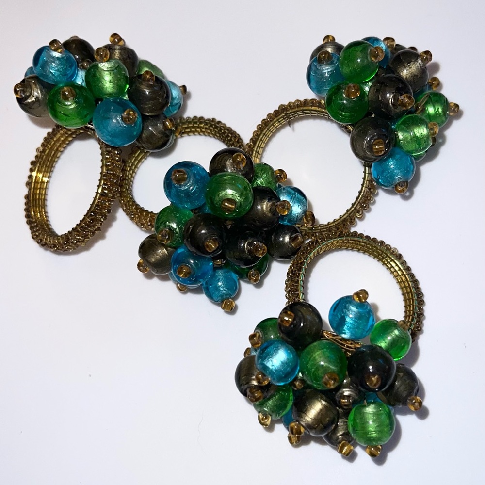 Pier 1 imports peacock 🦚 color napkin rings. Set of 4